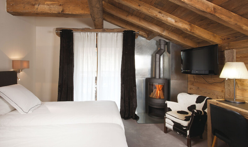 Cosy room with a little fireplace, Les Gets Holidays, La Marmotte hotel
